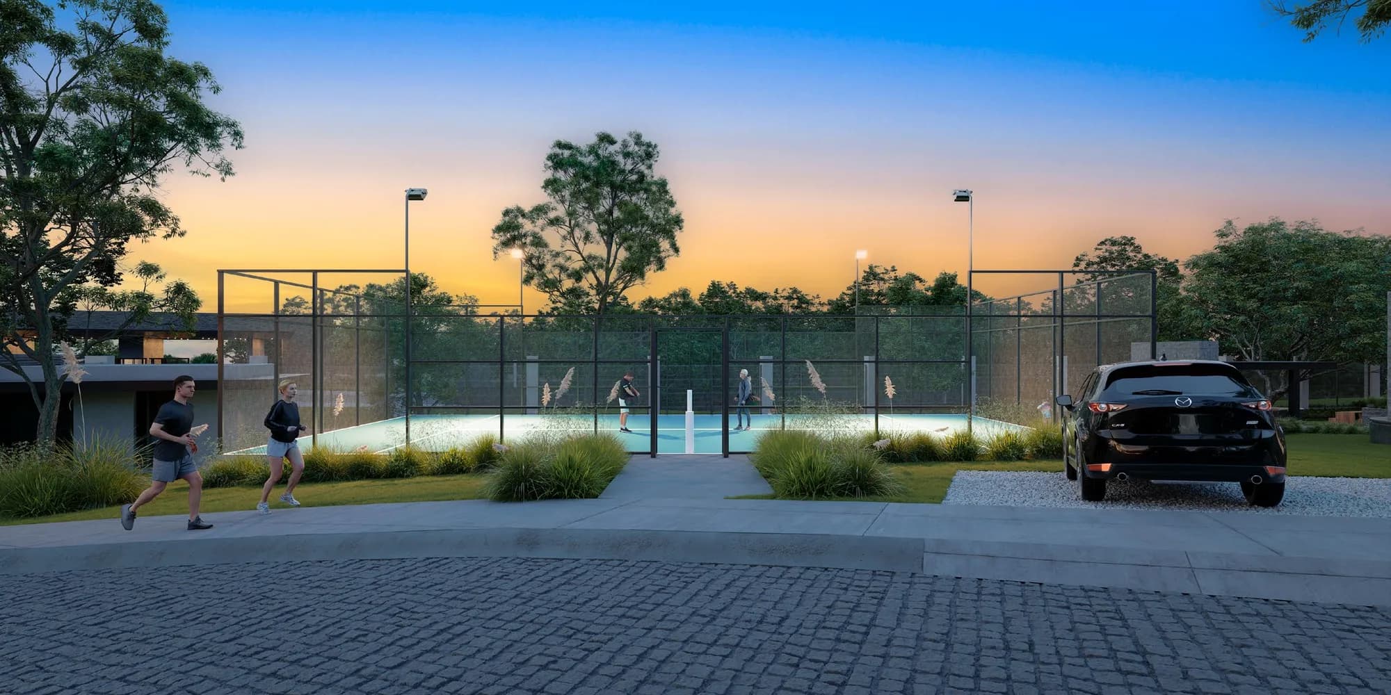 Cancha de pádel iluminada al atardecer con corredores en el andador
